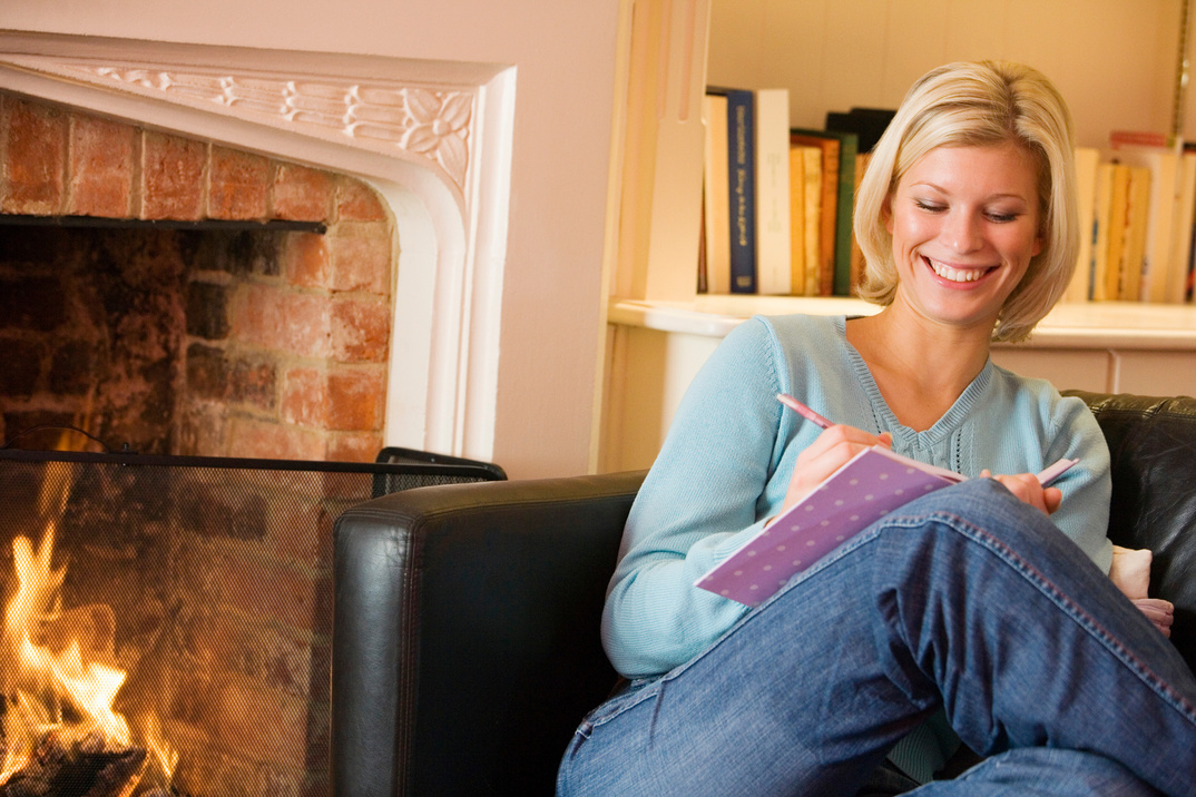 Woman writing in journal